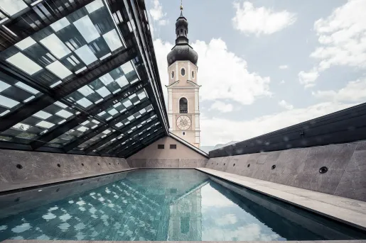 Outdoor pool with a large clocktower in the background