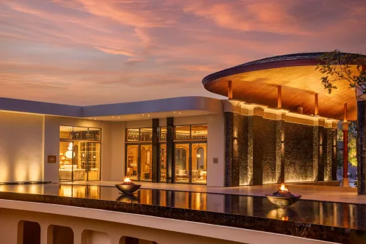 resort lit up at sunset