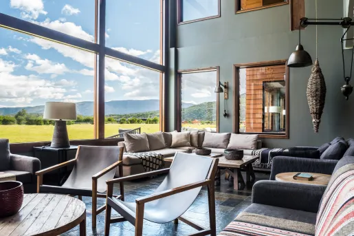 Lounge with cushioned couches and coffee tables