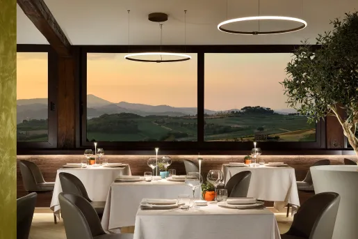 hotel dining room with view of the mountains at sunset