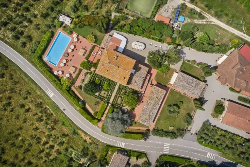 Sky view of hotel property, with an outdoor pool