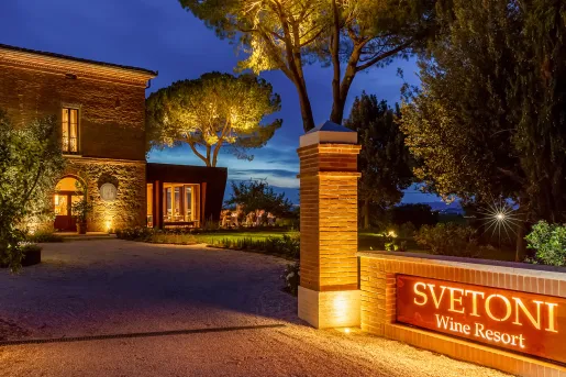 Nigh time view of hotel with illuminated outdoor sign