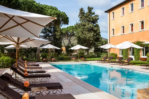 hotel pool with lounge chairs