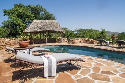 pool with lounge chairs