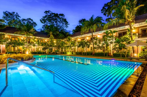 swimming pool lit up at night