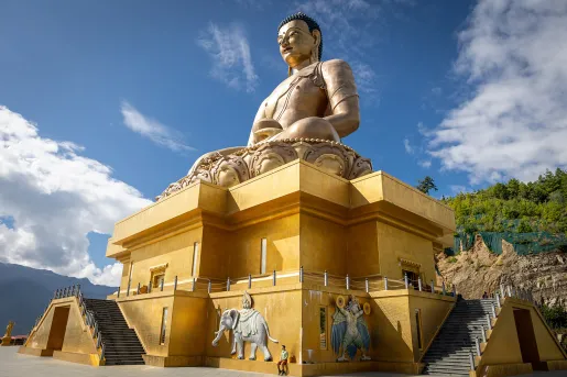 Large temple with a Buddhist statue on top