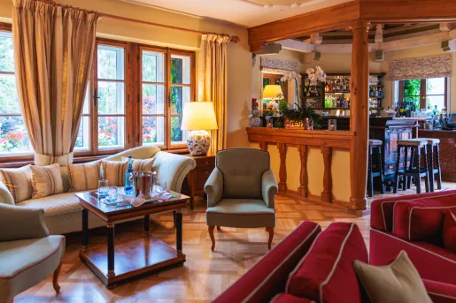 Indoor lounge with a wooden bar on the right