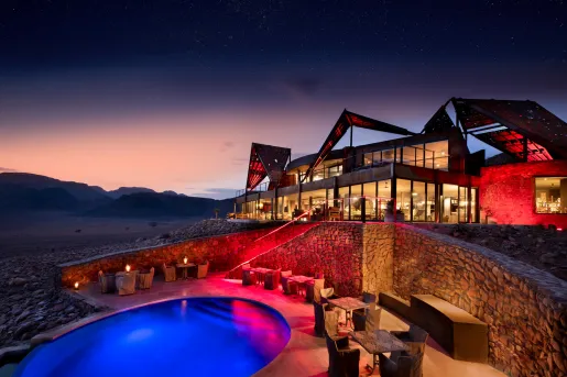 pool and hotel lit up at night