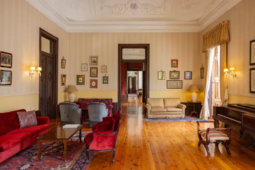 living room with wood floors and velvet couches