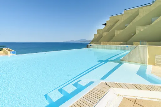 Outdoor pool with views of the vast ocean in the distance