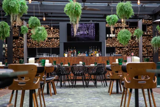 Outdoor dining area with a bar counter in the background