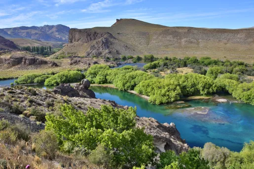 Open valley with a river flowing between two plots of land