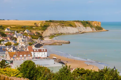 Small town next to a beach and large cliffs