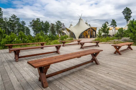 Outdoor patio with wood flooring and wooden benches