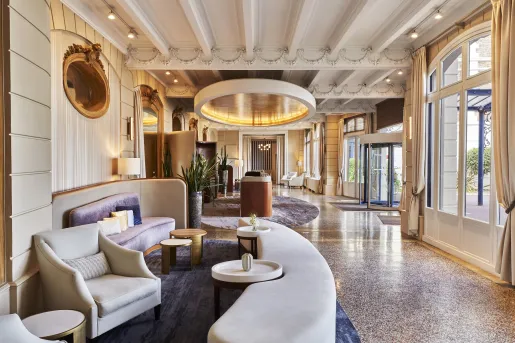 Hotel lobby with crescent-shaped white sofas