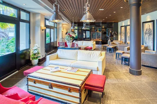 Lounge with cushioned sofas and metal pillars