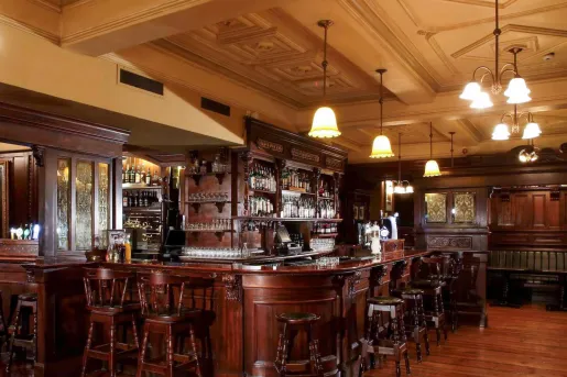 Bar and lounge with wooden stools and counters