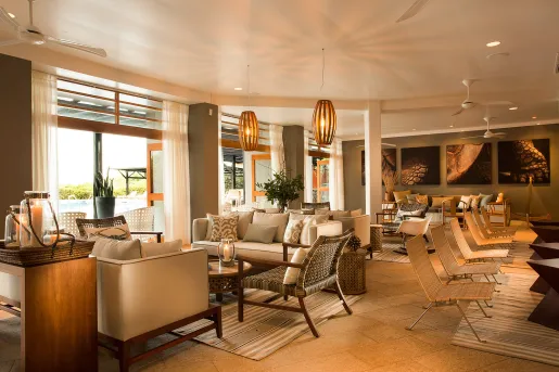 Indoor lobby and lounge area with reclined, cushioned chairs