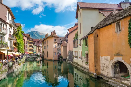 River in a city with crowds of people to the left