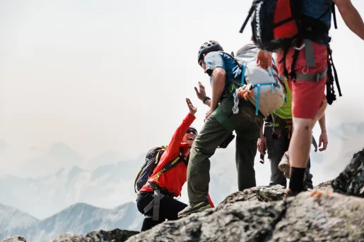 Backroads guests climbing up a mountain in the fog