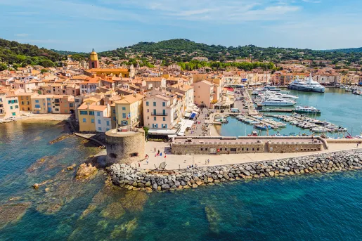 European, beach-side town with beige buildings by the water