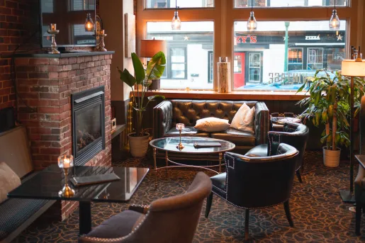 Seating area with large windows looking out towards a street