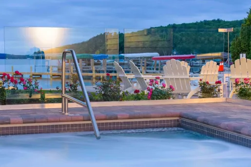 Outdoor pool with glass barricades and the ocean in the background
