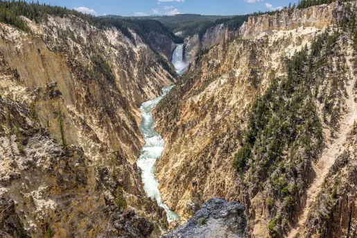 Active river cutting through two large mountains