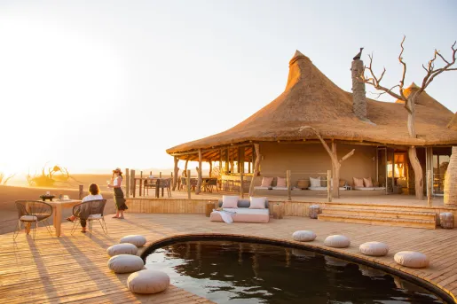 Large hut with an outdoor pool in front