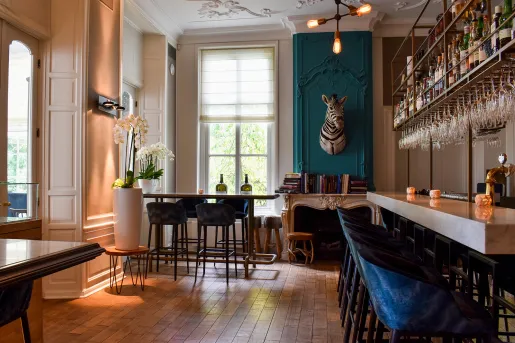 Indoor bar and lounge with a zebra head hanging on the wall