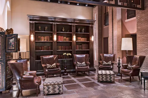 Library and seating area with 4 large leather chairs