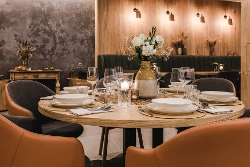 Restaurant with dining table and brown chairs