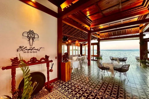 Entrance to hotel with view of ocean in the distance