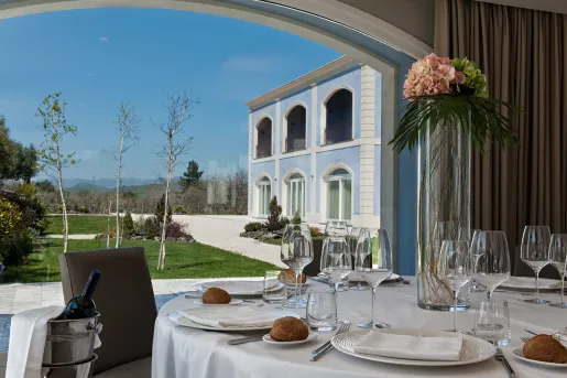 A table is set on a patio at Villa Neri