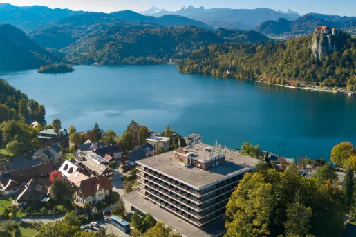 Sky view of a large lake with buildings surrounding it