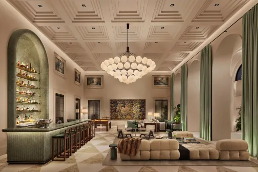 Hotel lobby with large chandelier and couches around the room