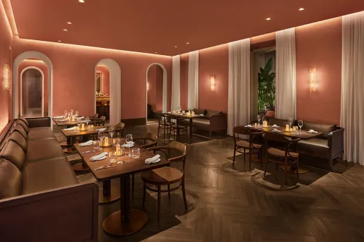 Bar and lounge with cushioned, leather sofas and small tables