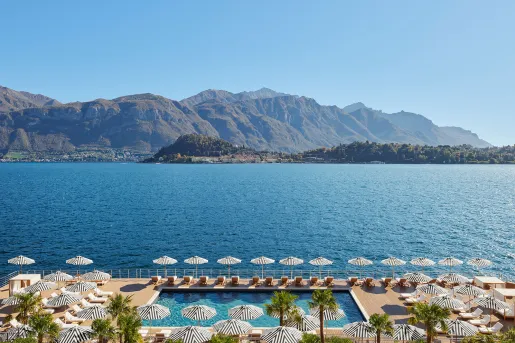 Row a chairs along a port by the ocean