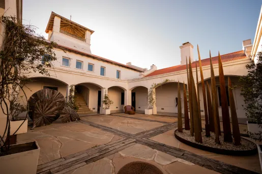 Outdoor courtyard with a large building in the back