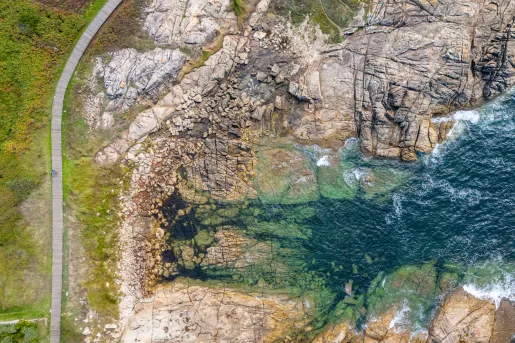 Sky view of ocean and large cliffs