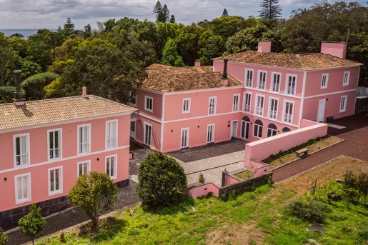 Exterior view of pink hotel complex building