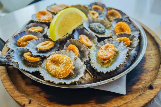 Plate full of freshly shucked mussels