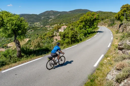 A lone biker in a Backroads jersey bikes along the scenic route from Provence to the French Riviera.