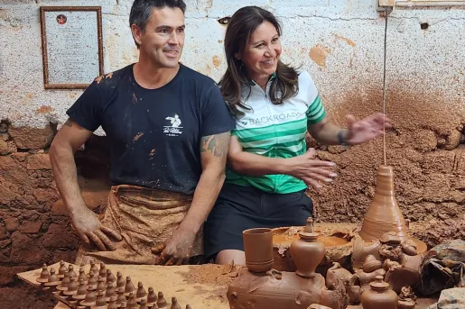 Two Backroads guests in a terracotta pottery workshop in Portugal.