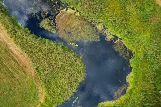 Sky view of a lake in the middle of a valley