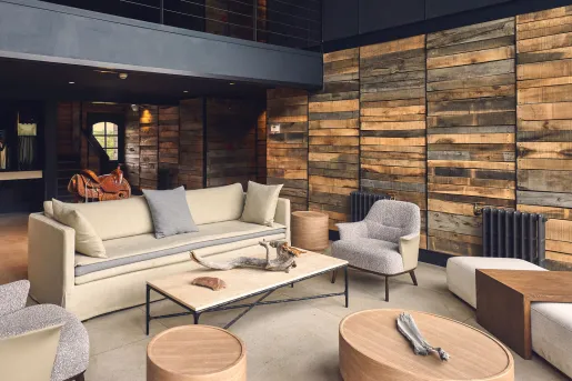 Lounge with beige soda and gray chairs