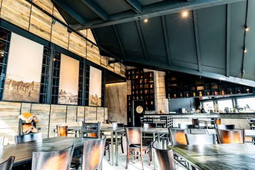 Restaurant with large wooden tables and chairs