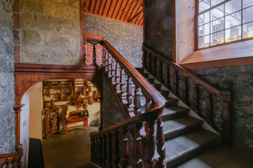 Staircase in a building, with stone walls