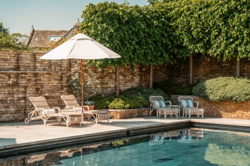 The outdoor swimming pool at Thyme hotel located in Southrop, Gloucestershire, in the Cotswolds, UK.