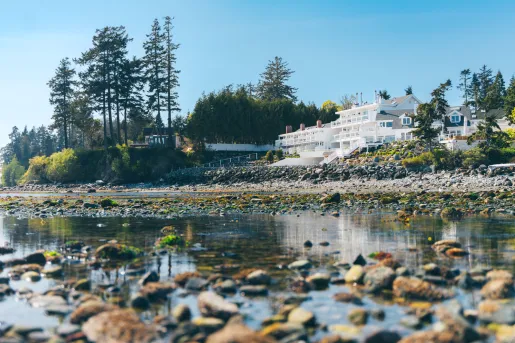 Exterior view of Sooke Harbour House, a hotel located on the coast of the Gulf Islands in British Columbia, Canada, featuring waterfront architecture.